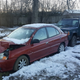 Illustration for article titled You Havent Reached Rock Bottom Until Youve Got A Totaled Kia Rio Stuck In Your Backyard